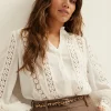blouse met tape details