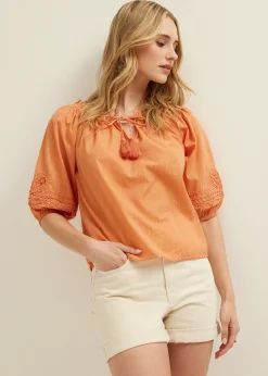 Oranje top met tape details