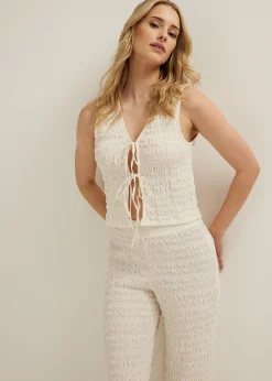 Singlet met striksluiting